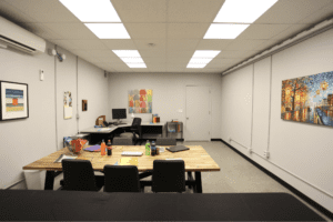 Photo of a PNNL light perception testing laboratory illuminated by Telelumen Dittosizer programmable LED luminaires. The photo shows the light quality to be programmed to “warm” appearance, red spectrum enhanced, CCT values less than 4000K.